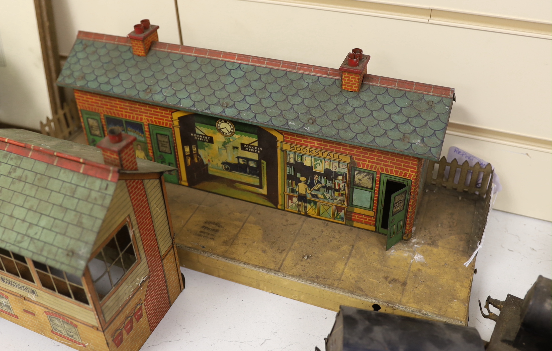 Three Bing tinplate O gauge locomotives, two Hornby tinplate buildings, various carriages, track etc.